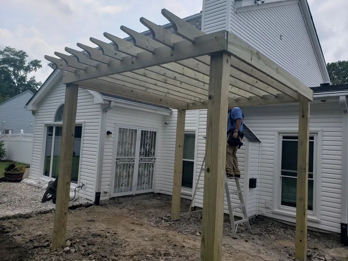 Custom pergola being built off the back of a Norfolk home