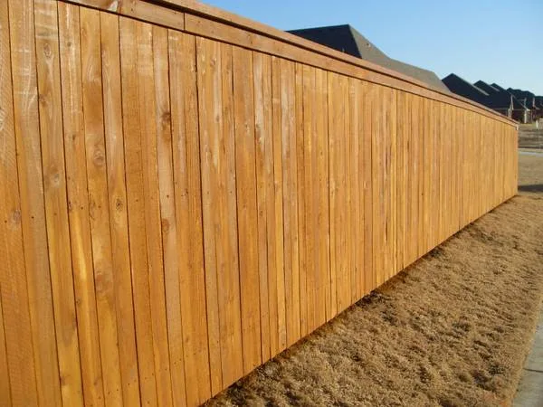 Master Chief build: cap and trim wood privacy fence, stained
